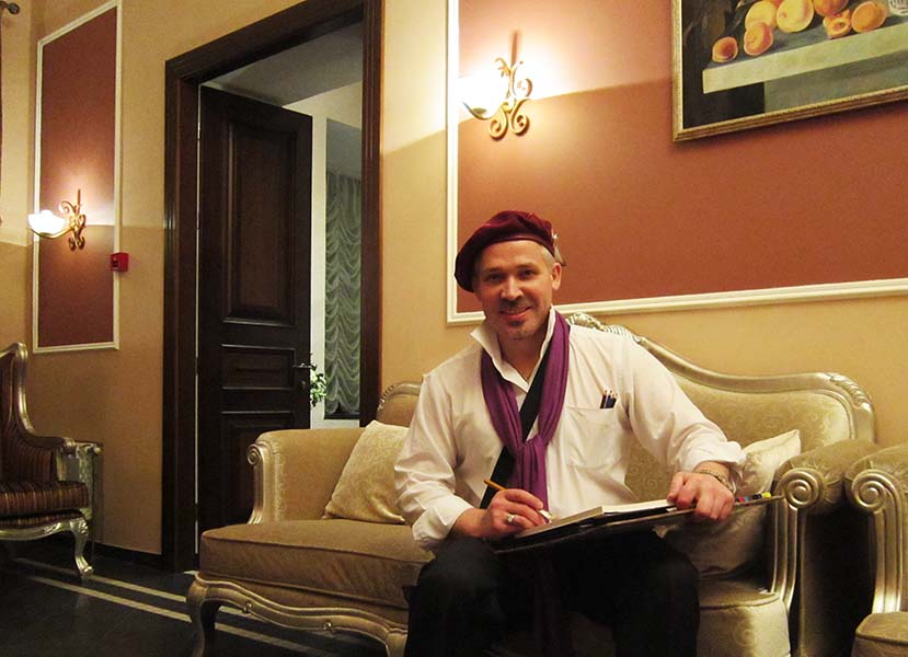 шаржист Михаил Шабалин позирует на свадьбе в доме Ваньковичей